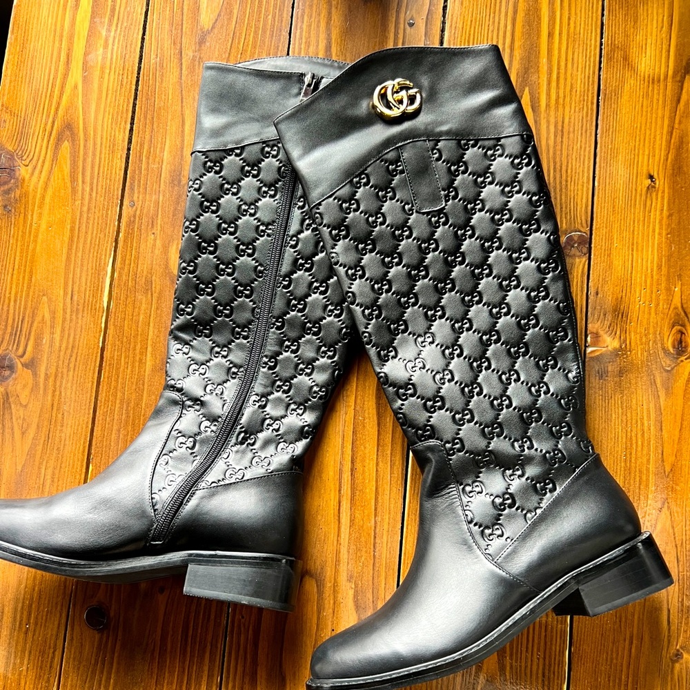Tall black Gucci designer boots